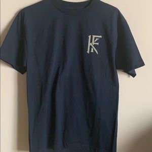 Dark Blue or Navy T-Shirt.